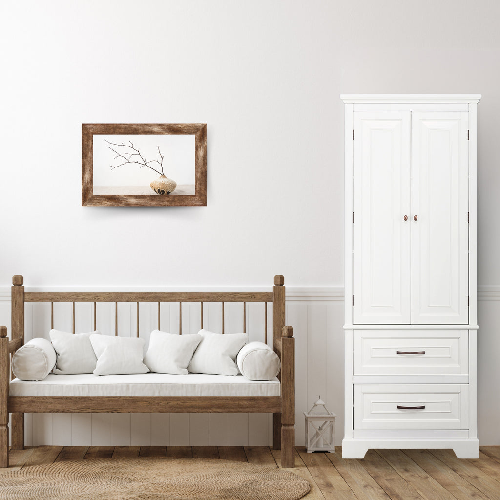 A white storage cabinet next to a coach in a living space