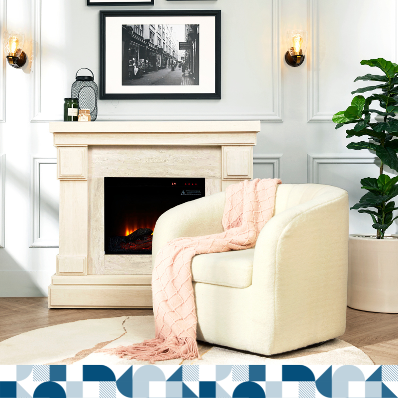 A cozy living space with a white fireplace, a white sofa chair with a pink blanket on it